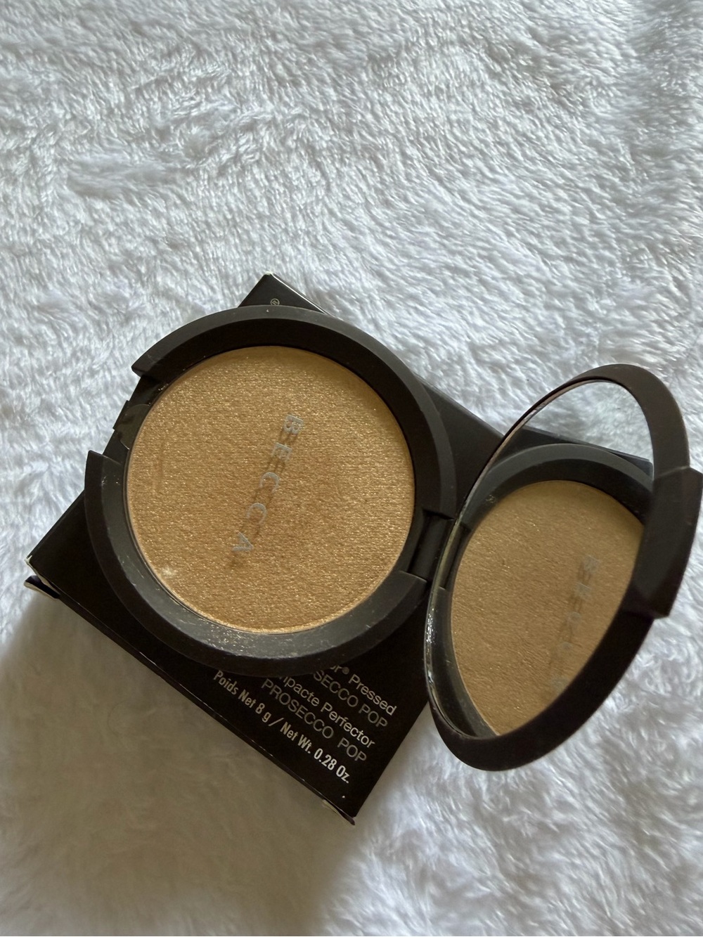 Discontinued Becca highlighter in Prosecco pop